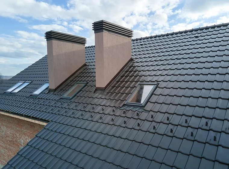 New tiled roof with chimneys and skylights